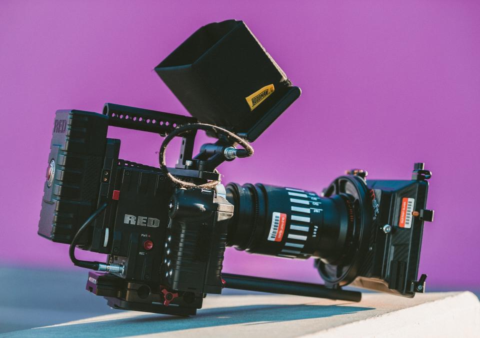 Professional cinema camera rigged for a shoot, the source footage behind a video repurposing plan